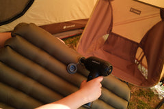 Portable electric air duster used to pump an inflatable mattress