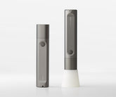 Two gray electronic devices on a white background