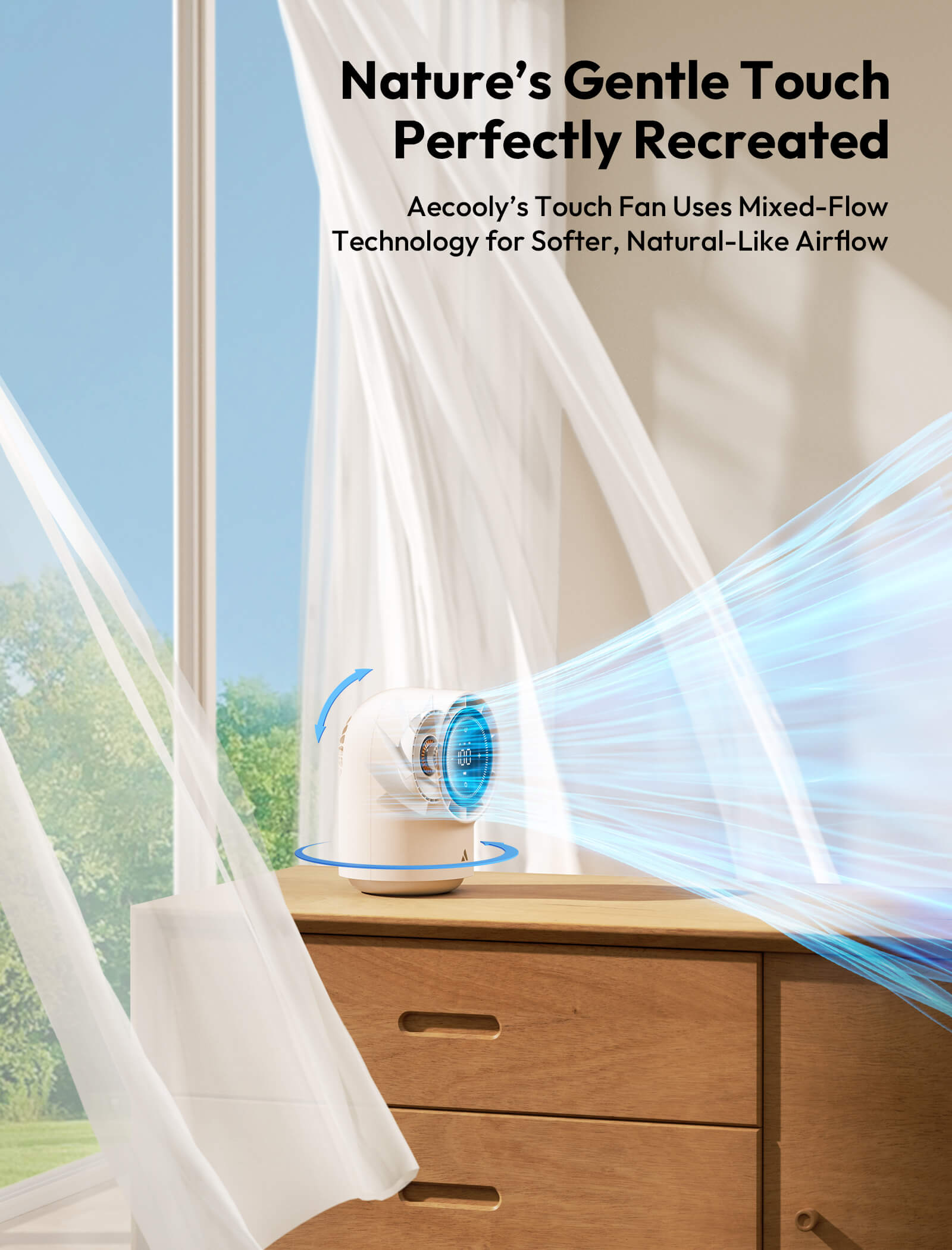 A cooling fan on a dresser with curtains open, showing a scenic view outside.