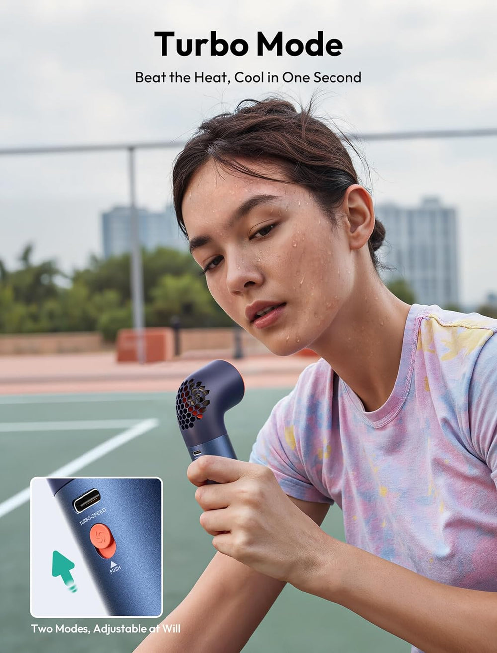 Person using a handheld fan device on a tennis court with 'Turbo Mode' text above.
