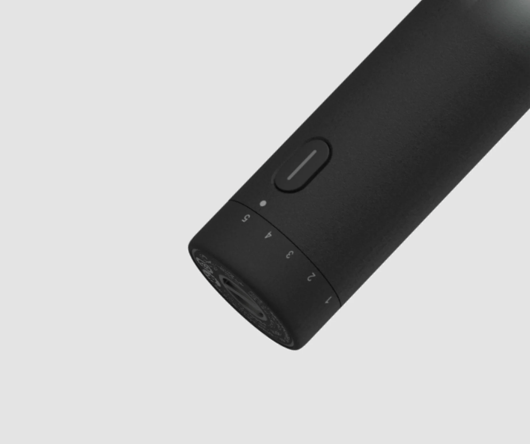 Black electronic device with buttons on a light gray background