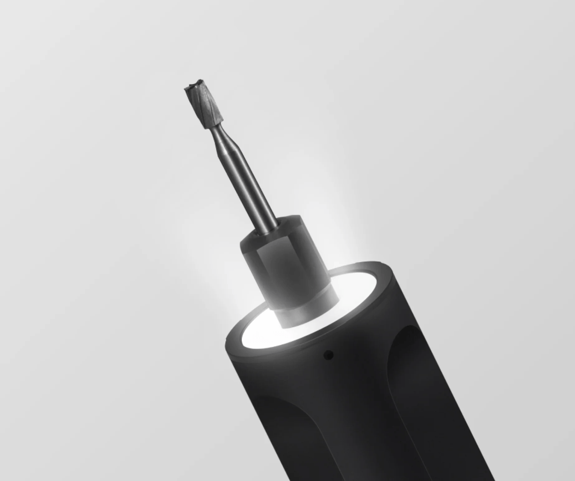 Black screwdriver on a light gray background