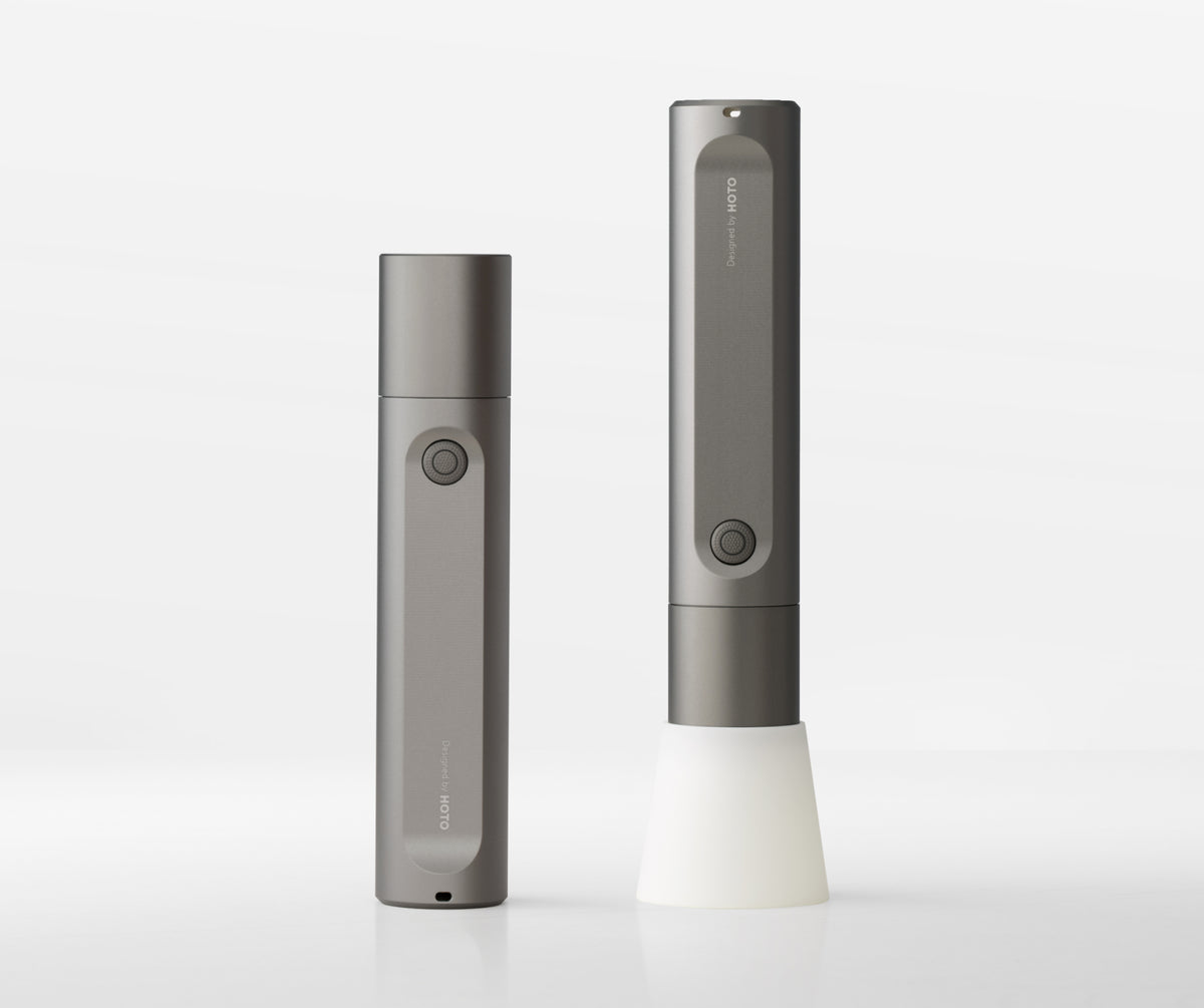 Two gray electronic devices on a white background