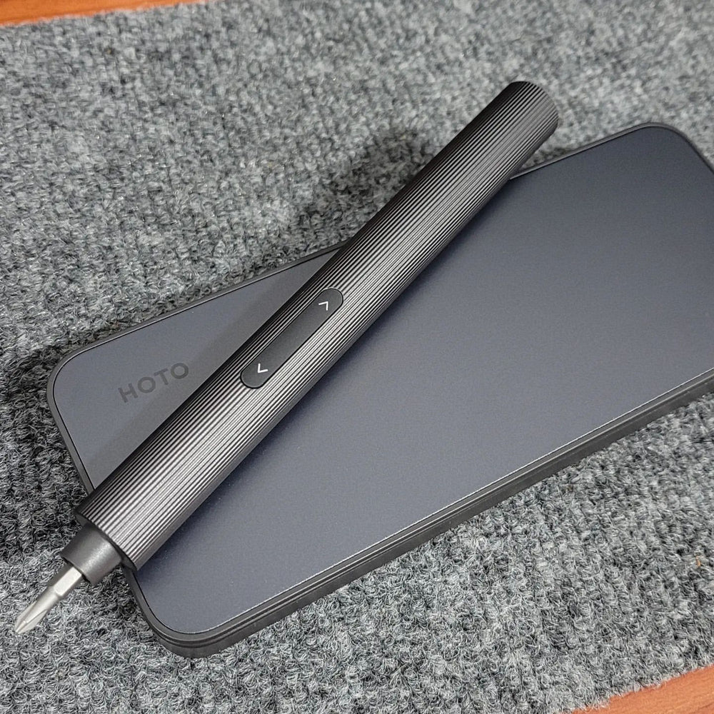 Gray electronic device with a stylus on a textured surface