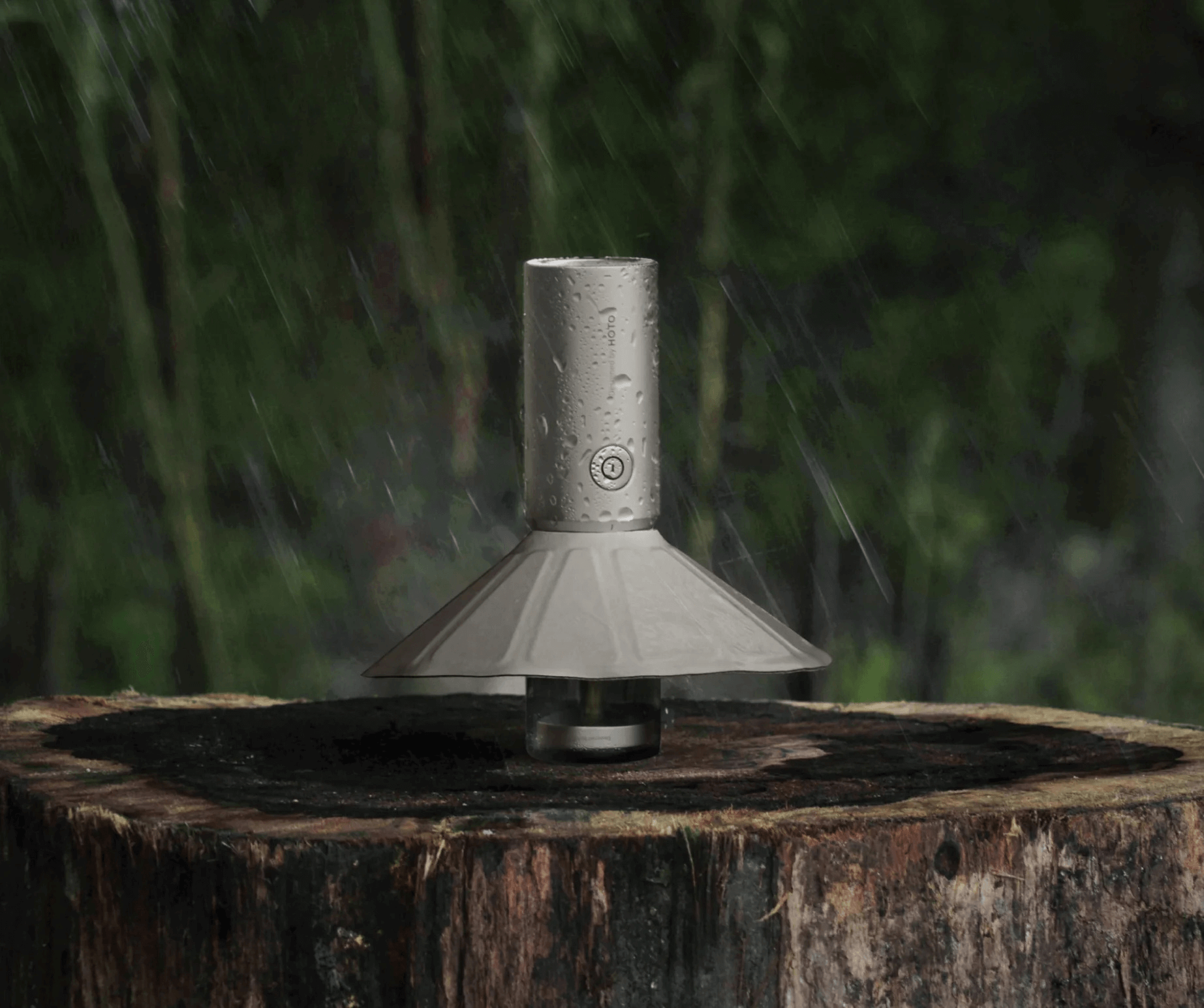 Metallic device on a wooden stump with a blurred natural background