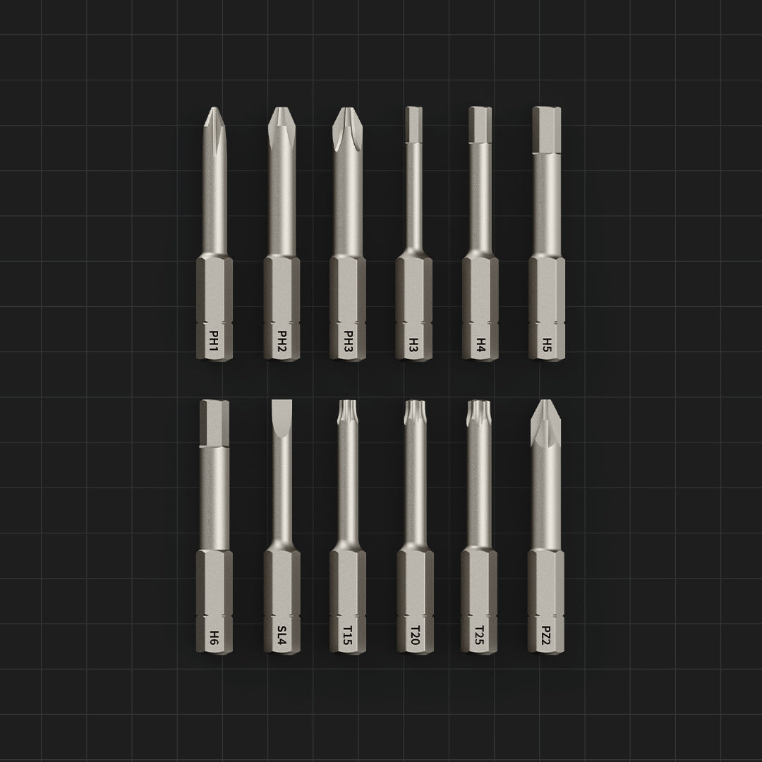 Set of screwdriver bits arranged in a grid on a black background