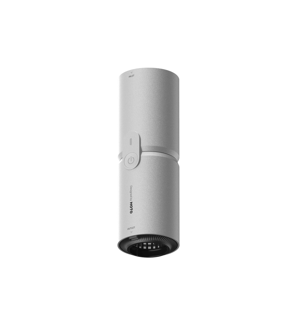 White cylindrical device with a power button on a black background
