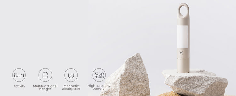 White electronic device on a rock with icons and text on a light gray background