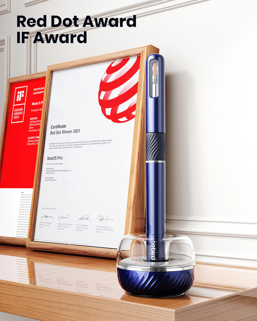 bebird ear cleaner with Red Dot Award and IF Award certificates in the background.