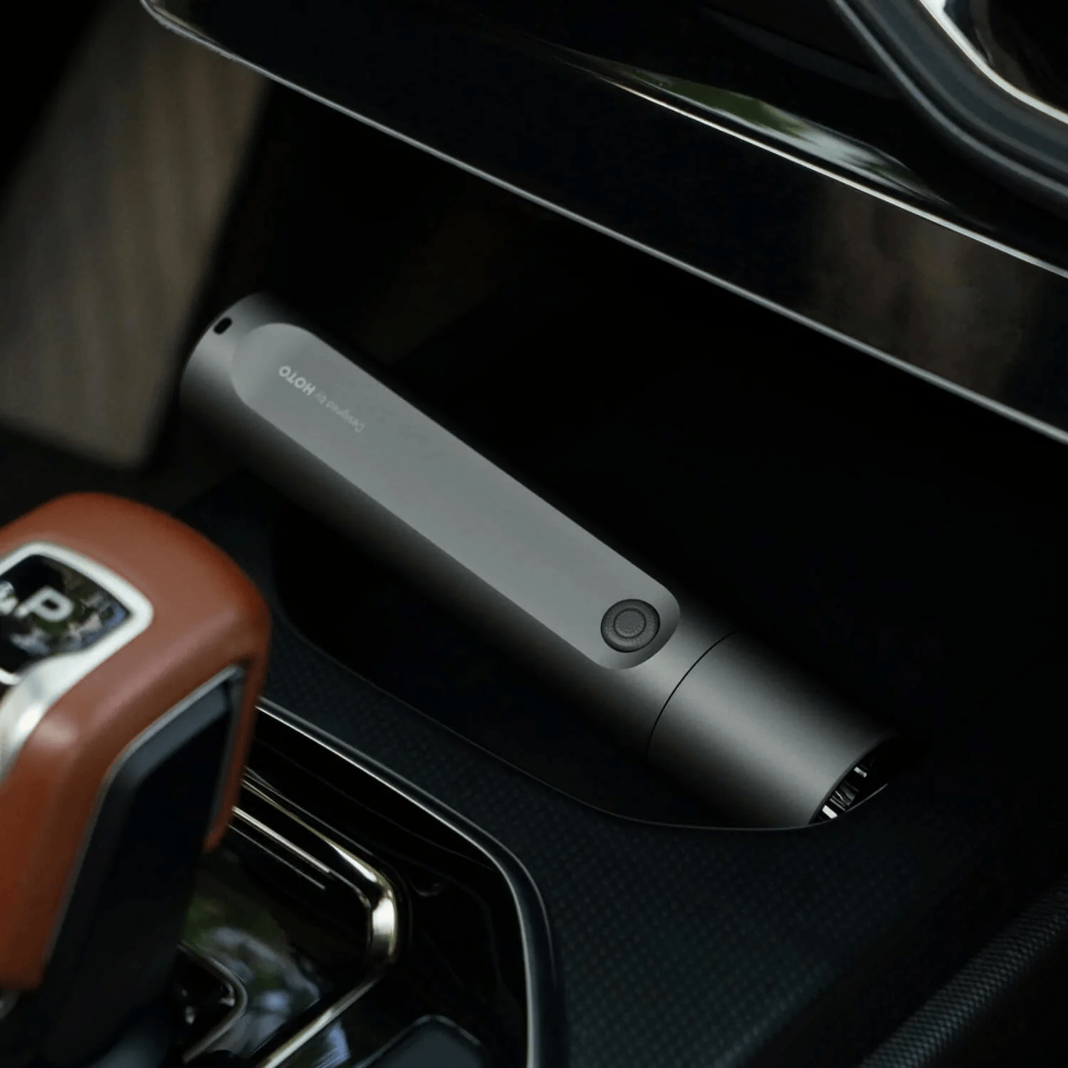 Black electronic device on a car dashboard