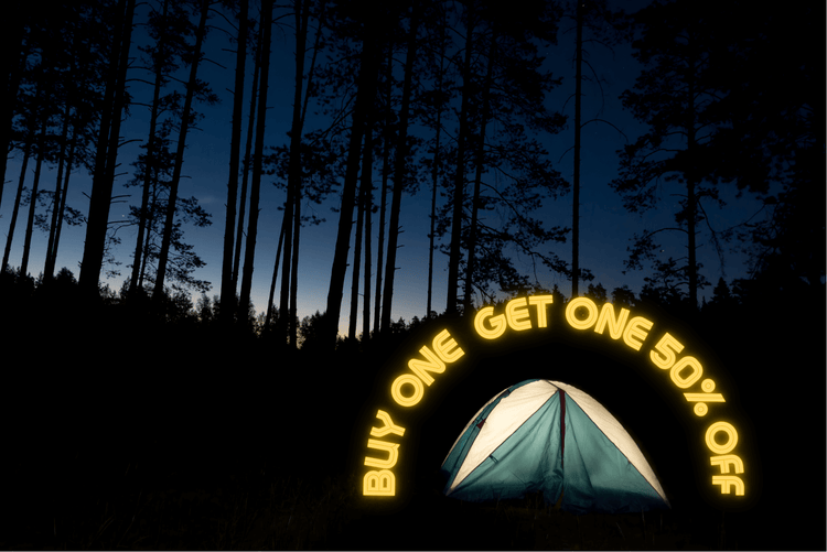 Camping tent with glowing neon sign in a forest at night