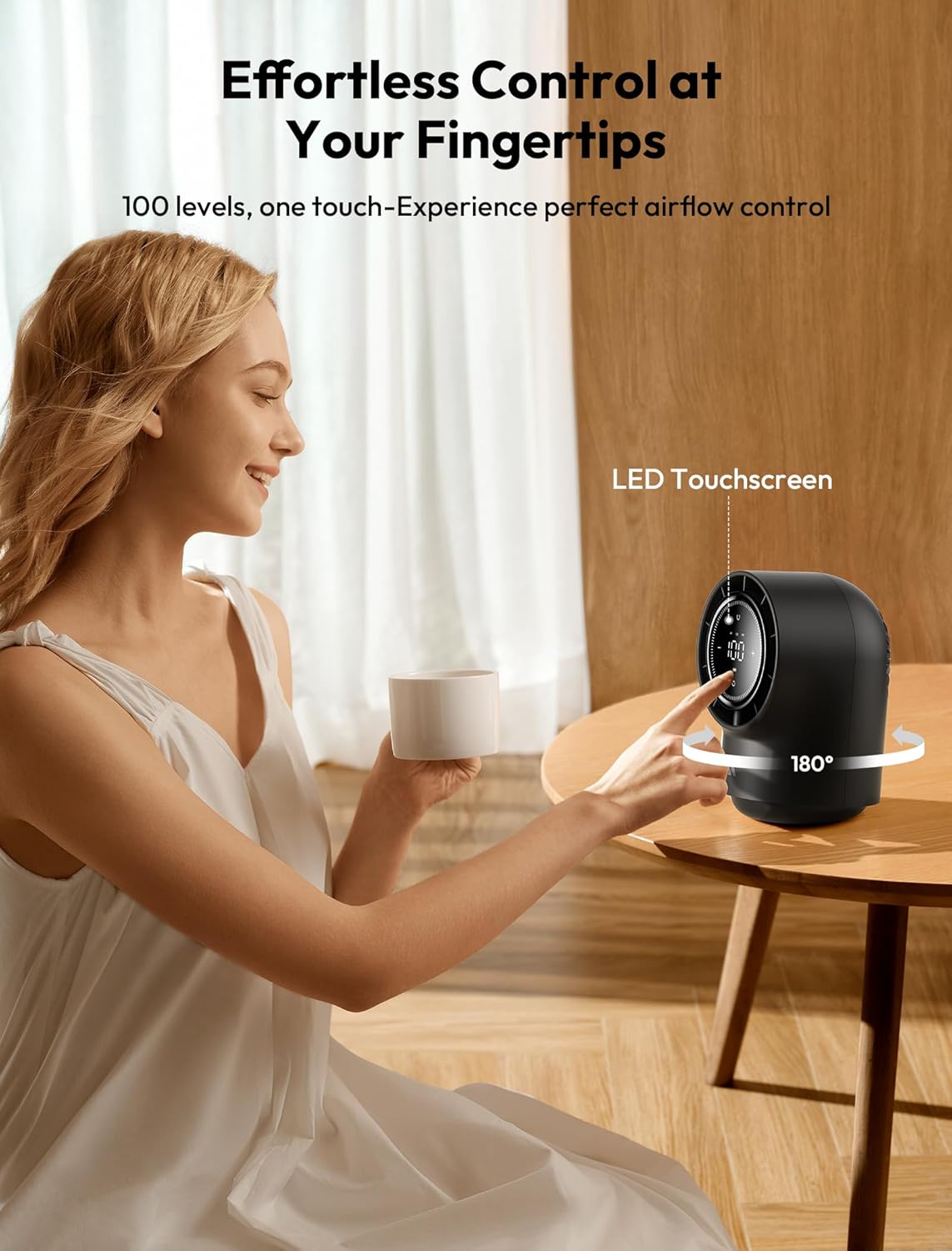 Woman using a desk fan with LED touchscreen in a home setting